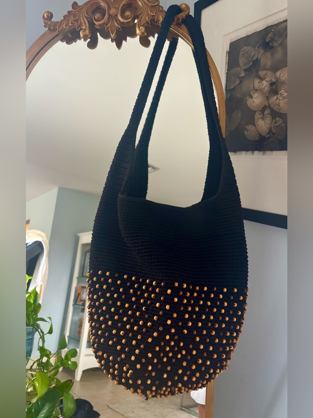 The SAK Black Crochet Shoulder Bag with brown beads.